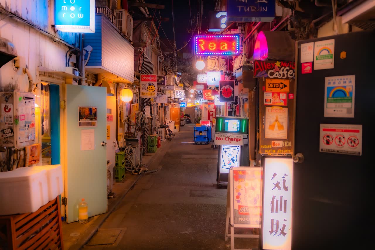 A quiet neon-lit alleyway at night